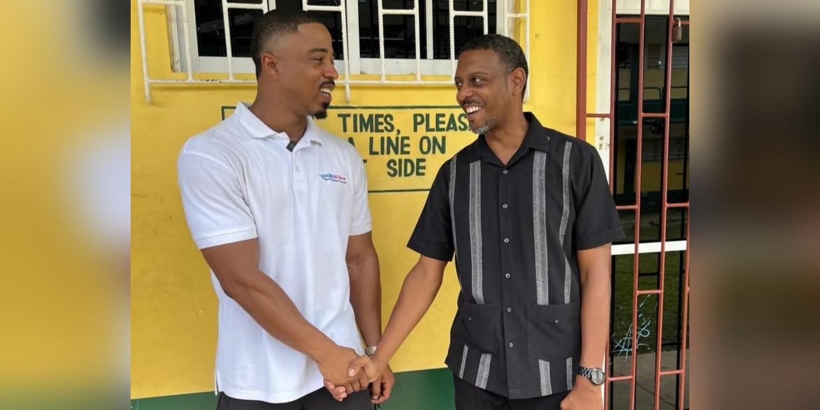 Dr. Franz Collins and Dwayne Vaz MP shaking hands at Petersfield High School