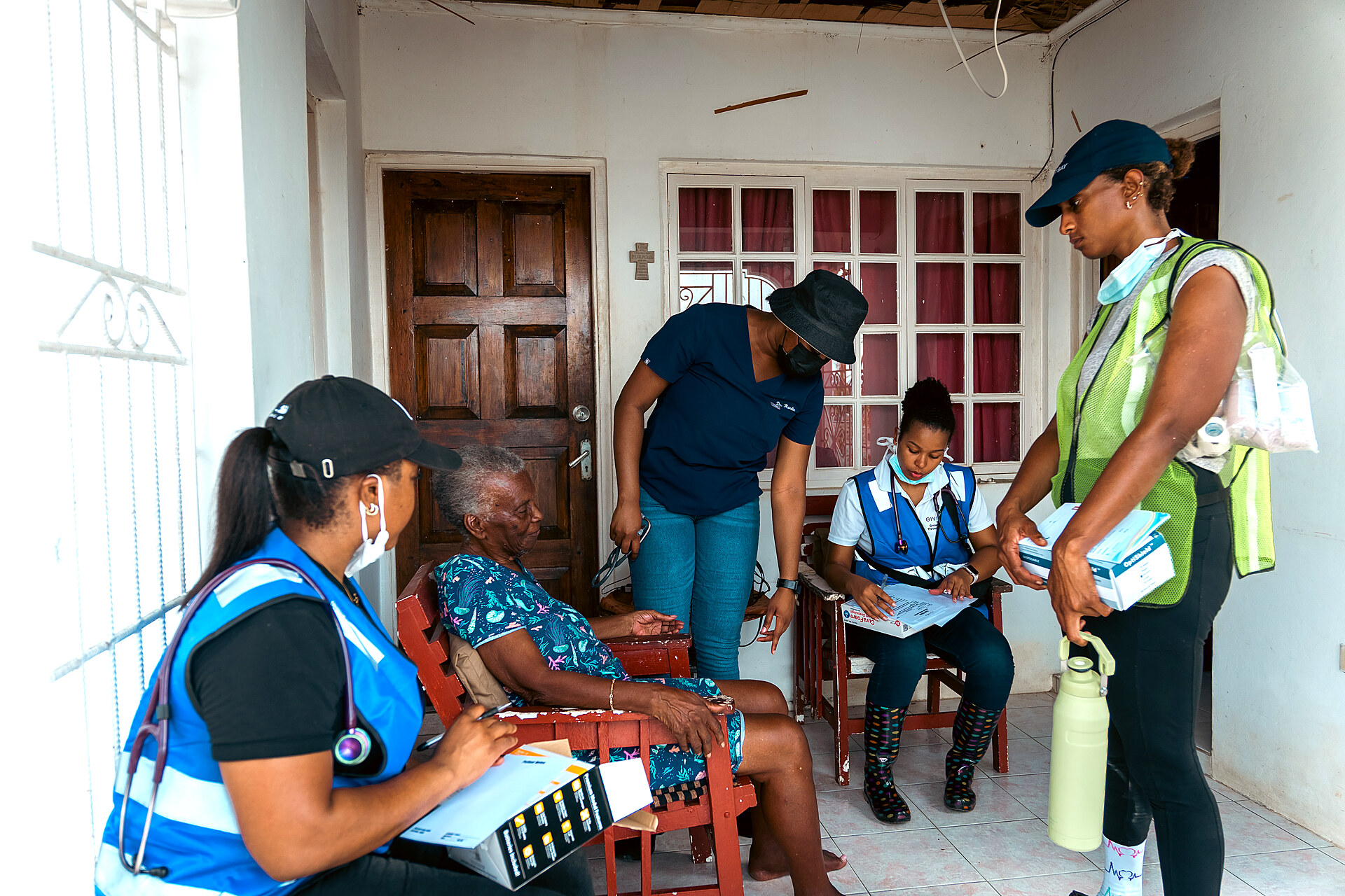 CASSM mobile medical team providing care to a resident inside a home in Black River